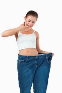 Surprised woman of having weight loss fasr