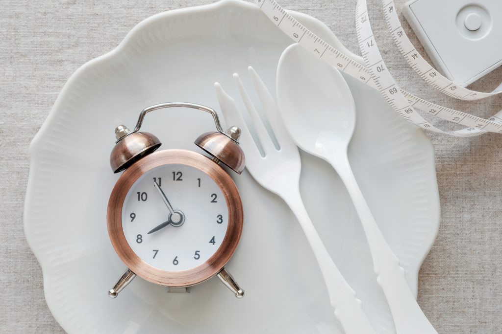 A clock on the plate and tape measure
